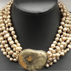 Cream Multi-Strand Pearl Necklace with Luxurious Look and Earthy Centerpiece